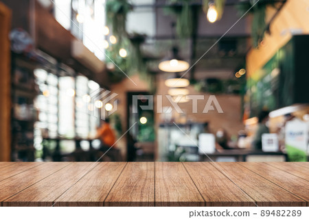 Empty wooden table top with lights bokeh on blur restaurant background.	 89482289