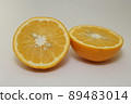 Amanatsu cut in half on a white background 89483014