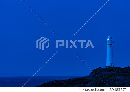 Lighthouse at the tip of the cape before sunrise Lighthouse at the tip of the cape before sunrise 89483571