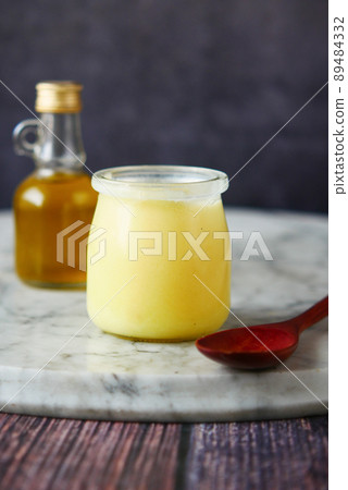 homemade ghee in container on a table , homemade ghee in container on a table , 89484332