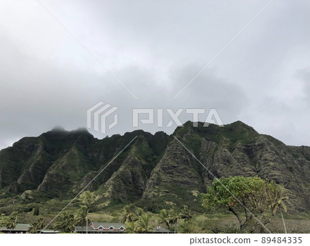 Kualoa Ranch in the cloudy sky Hawaiian mountains Kualoa Ranch in the cloudy sky Hawaiian mountains 89484335
