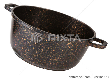 large aluminum pan with a brown art coating, tilted, as if levitating, on a white background 89484667