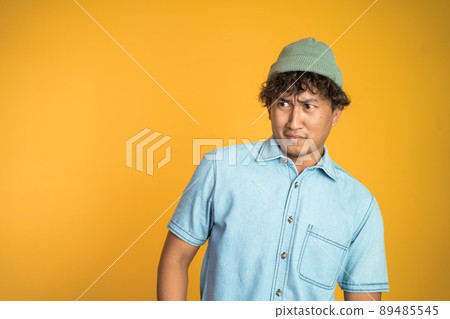 man with disgusting expression isolated over white background man with disgusting expression isolated over white background 89485545