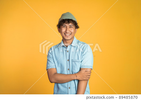 asian man stand with crossed hands on isolated asian man stand with crossed hands on isolated 89485870