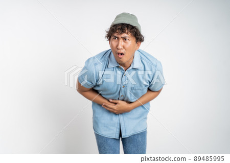 man having stomach ache on background isolated 89485995