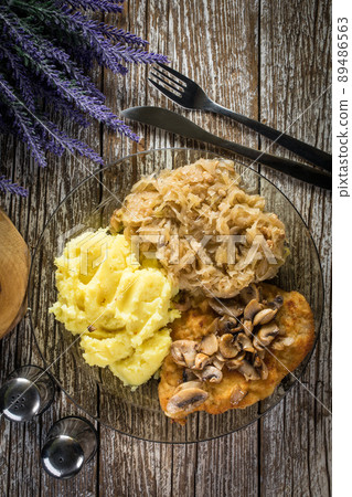 Breaded pork chop with mushrooms. 89486563