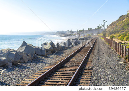 Train track in San Clemente, California with a view of the beach and slope on the side 89486657