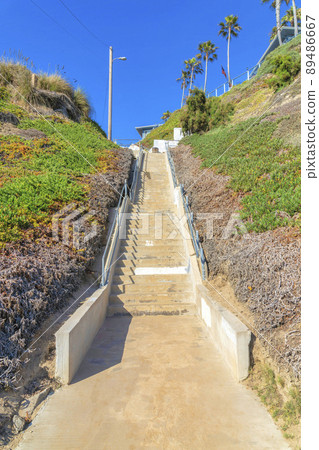 Outdoor concrete staircase on a slope with shrubs at San Clemente, California 89486667