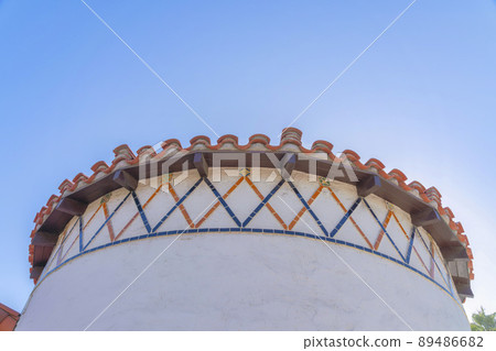 Low angle view of a curved wall with orange and blue trims in San Francisco, California 89486682