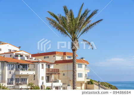 Apartment building with mediterranean style exterior and a view of ocean in San Clemente, CA 89486684