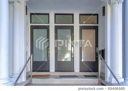 Three black front doors with glass panels and transom windows at San Francisco, California 89486980