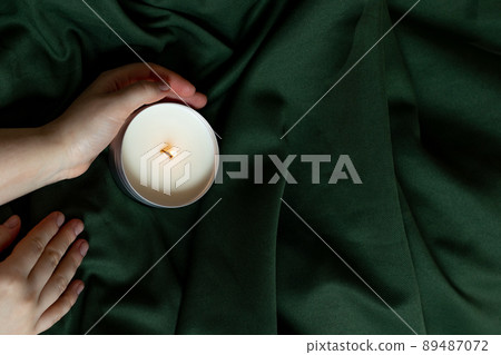 Soy candles in metal cans, handmade modern hobby , harmless coconut wax candles without paraffin on green background Soy candles in metal cans, handmade modern hobby , harmless coconut wax candles without paraffin on green background 89487072