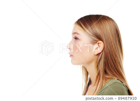 Looking ahead to a bright future. Profile of a gorgeous teenager. 89487910