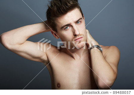 Looking good. Cropped shot of a handsome young man posing in the studio. 89488037