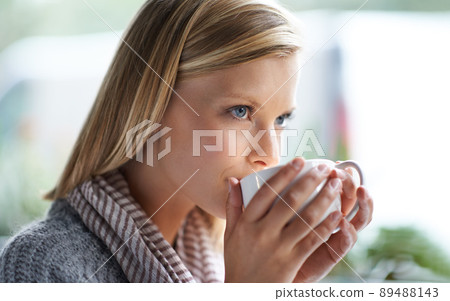We all need somewhere to go to be alone. A young woman sitting in a coffee shop. We all need somewhere to go to be alone. A young woman sitting in a coffee shop. 89488143