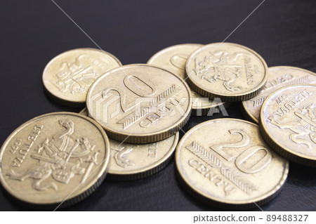 Heap of lithuanian coins on black background Heap of lithuanian coins on black background 89488327