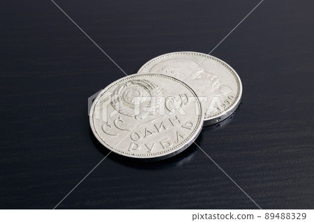 Two old USSR coins on a black background Two old USSR coins on a black background 89488329