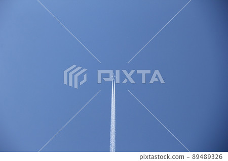 Sky landscape / blue sky where contrails are being drawn Sky landscape / blue sky where contrails are being drawn 89489326
