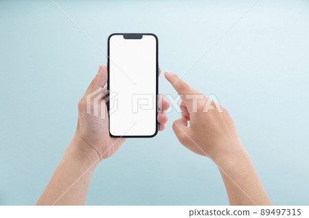 Hands of a man with a smartphone 89497315