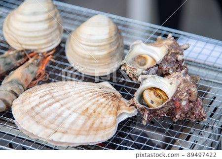 Bake seafood on the barbecue 89497422
