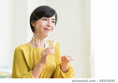 Women taking medicine Supplements Health 89503693