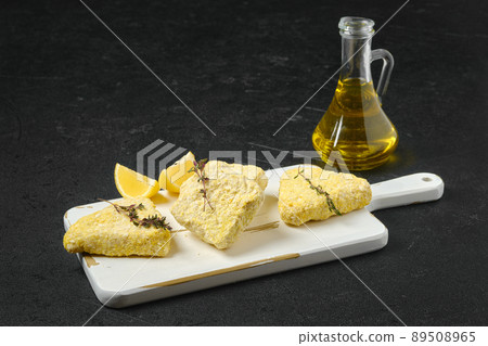 Semifinished frozen fish cutlet in breading Semifinished frozen fish cutlet in breading 89508965