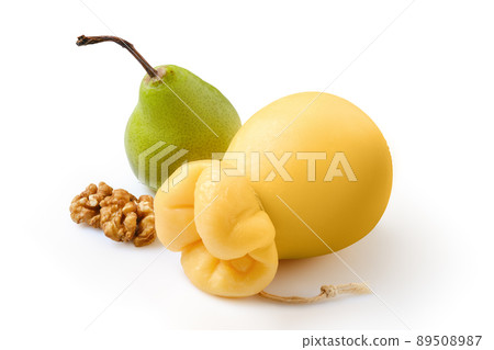 Pulled caciocavallo or scamorzza italian yellow cheese with pear and walnut 89508987