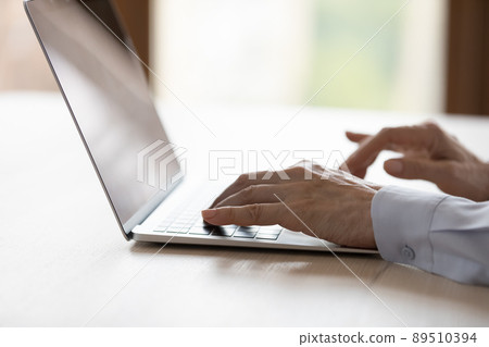 Hands of middle aged business woman typing on laptop keyboard 89510394