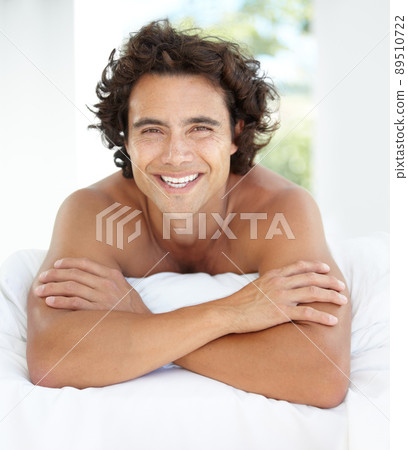 Enjoying a relaxing day at home. Portrait of a handsome young man relaxing at home. Enjoying a relaxing day at home. Portrait of a handsome young man relaxing at home. 89510722
