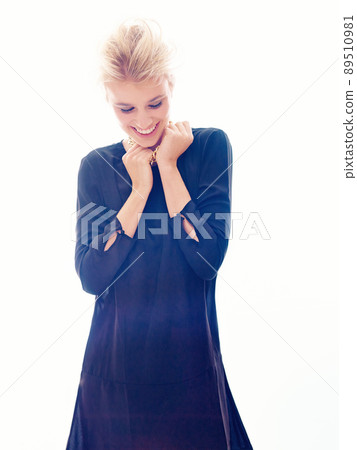 Posing with confidence. Studio shot of a beautiful young woman posing in the studio. Posing with confidence. Studio shot of a beautiful young woman posing in the studio. 89510981