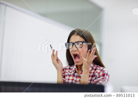 I dont have the patience for this. Shot of a young designer shouting. 89511013