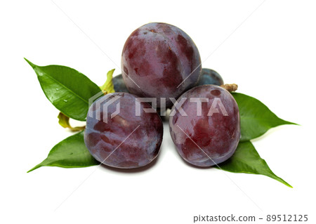 Organic plums isolated on white background 89512125