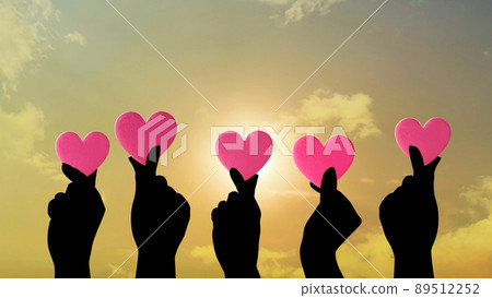 Five hands with hearts_dramatic sky background Five hands with hearts_dramatic sky background 89512252