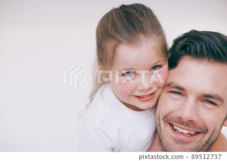Daddy and his little girl. An affectionate daughter embracing her father. 89512737