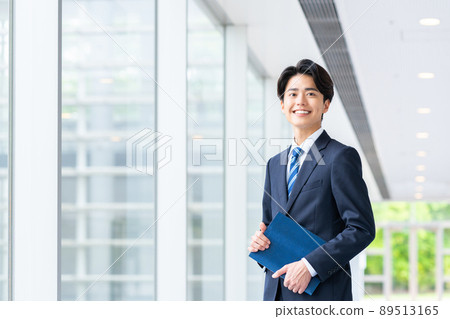 Young businessman in the office Young businessman in the office 89513165
