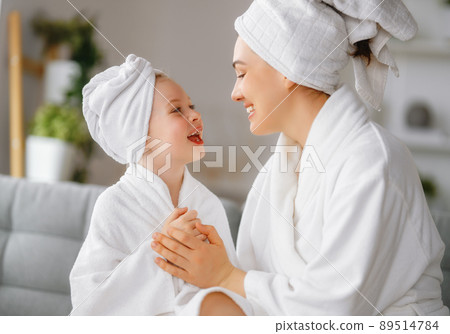 Mother and daughter after a bath 89514784