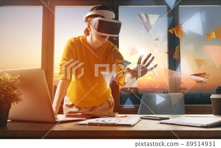 Woman with VR virtual reality goggles 89514931