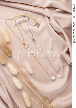 Handmade jewelry on a textile background. Gift for women. Bijouterie and jewellery for women Handmade jewelry on a textile background. Gift for women. Bijouterie and jewellery for women 89516621
