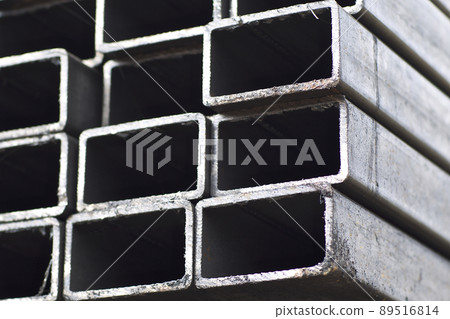 Metal profile pipe of rectangular cross section in packs at the warehouse of metal products Metal profile pipe of rectangular cross section in packs at the warehouse of metal products 89516814