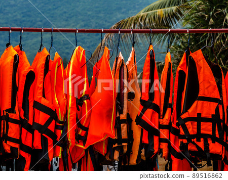 Life jacket hanging near the sea. 89516862