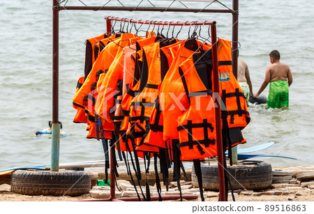 Life jacket hanging near the sea. 89516863