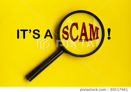 It's a scam text on yellow cover with magnifying glass. Scamming concept 89517461