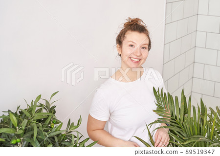 Young woman indoors. Home vacation portrait. Blogger selfie video. Alone Young woman indoors. Home vacation portrait. Blogger selfie video. Alone 89519347