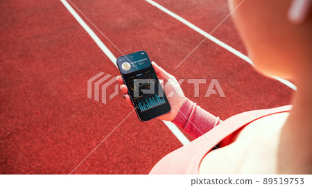 Health app. Smart phone screen with fitness health or sport gym mobile application. Woman holding home online workout app. Health app. Smart phone screen with fitness health or sport gym mobile application. Woman holding home online workout app. 89519753