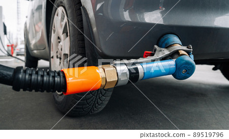 Refueling car. Pump gas at petrol fuel station. Gasoline oil nozzle tank from hand person. Automotive industry or transportation concept. 89519796