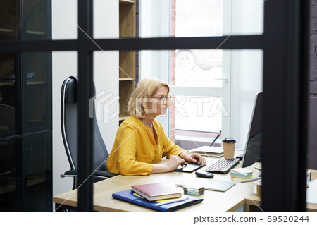 Graphic designer working at her study 89520244