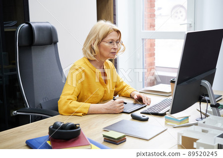Woman working on graphic tablet 89520245