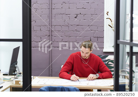 Designer drawing sketch plan at office Designer drawing sketch plan at office 89520250