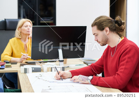 Professional architect drawing project at office Professional architect drawing project at office 89520251