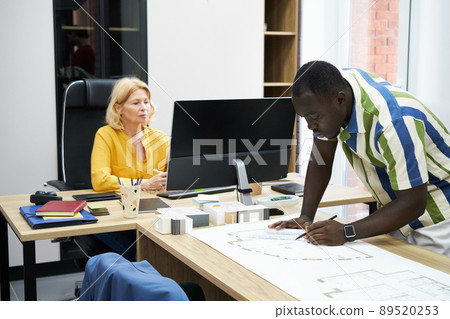 Couple of engineers working at office Couple of engineers working at office 89520253
